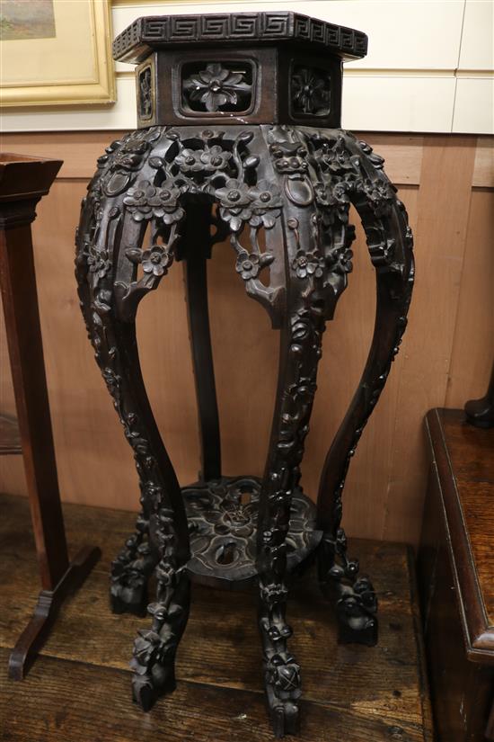 A Chinese hardwood hexagonal vase stand, with marble inset top, H.80cm